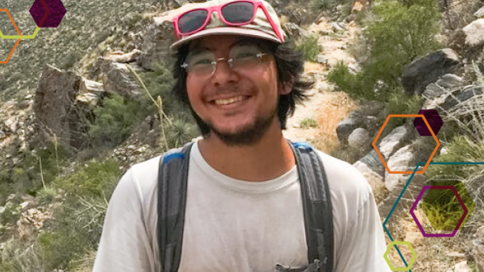 Reymond Miyajima, EEOB undergraduate student on steep trail