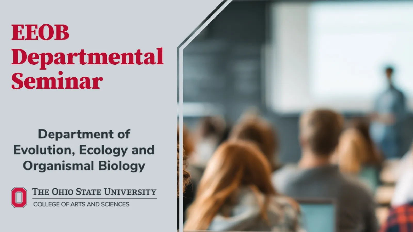 portion of gray block O that overlays blurred image of seminar presenter in front of audience.
