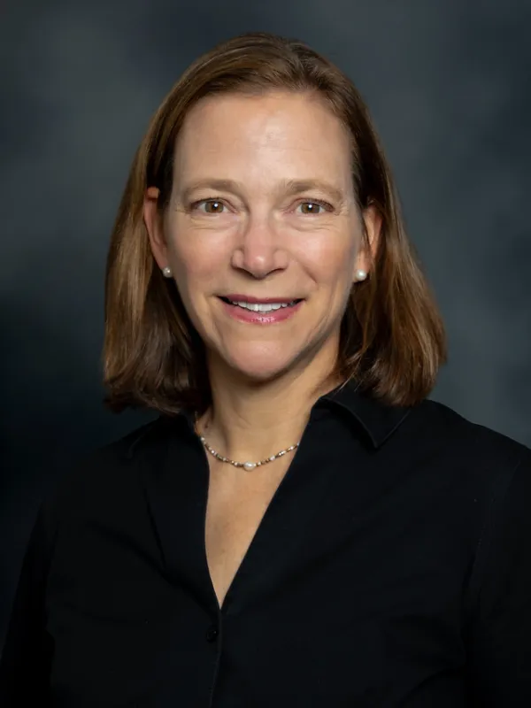 Karen Goodell headshot with gray background