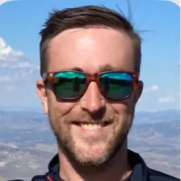 headshot of Aaron Wenzel outside